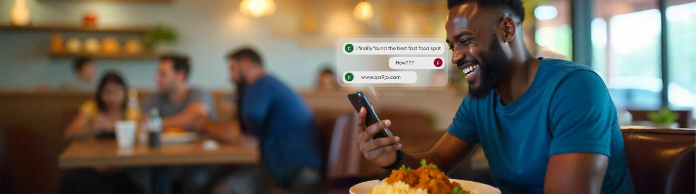 A smiling man in a blue shirt enjoys a plate of food at a restaurant while checking his phone. On-screen messages read “I finally found the best fast food spot,” followed by “How???” and “www.qsr9ja.com.” Other diners are seen in the background.